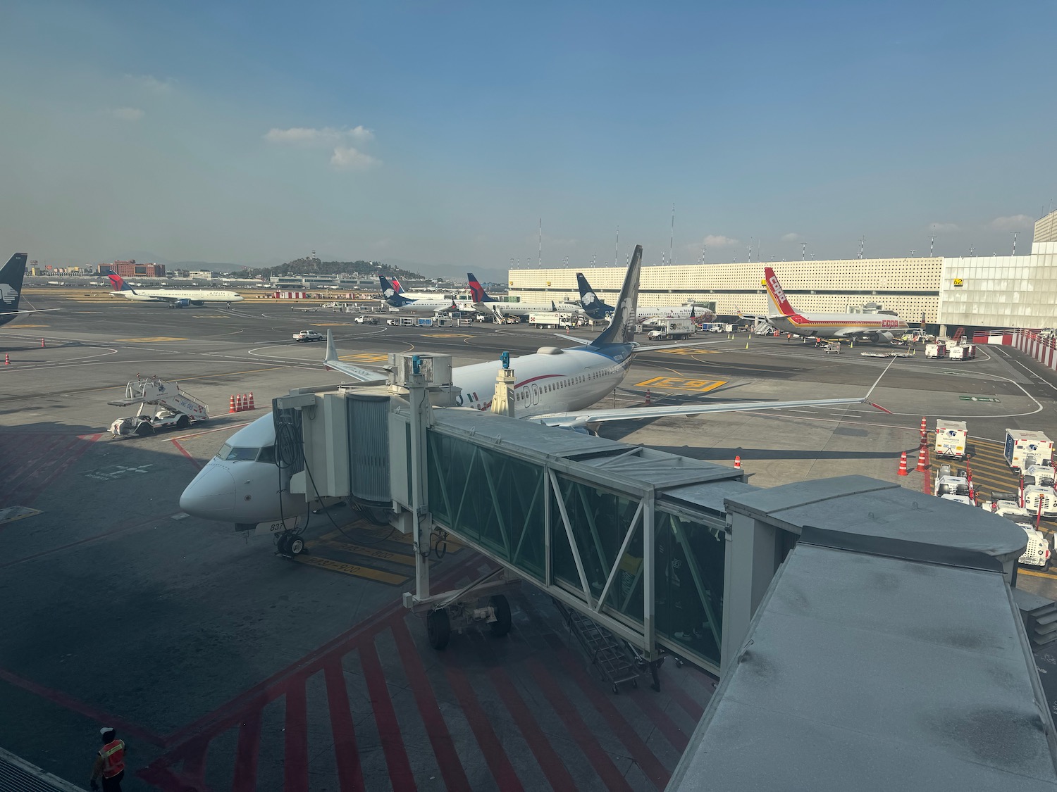 an airport with airplanes on the ground