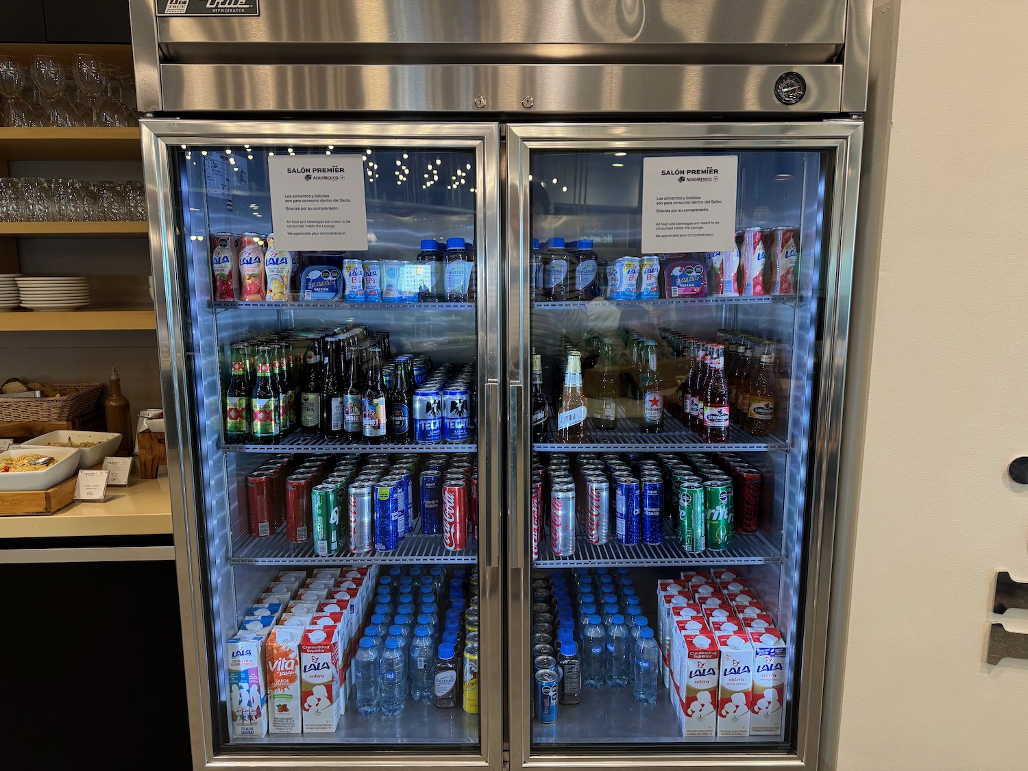 a refrigerator with drinks and beverages