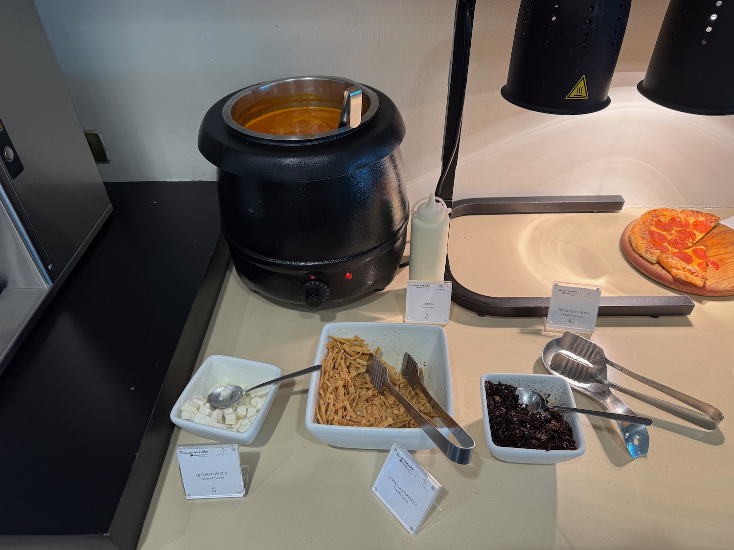 food on a counter with a pot of food