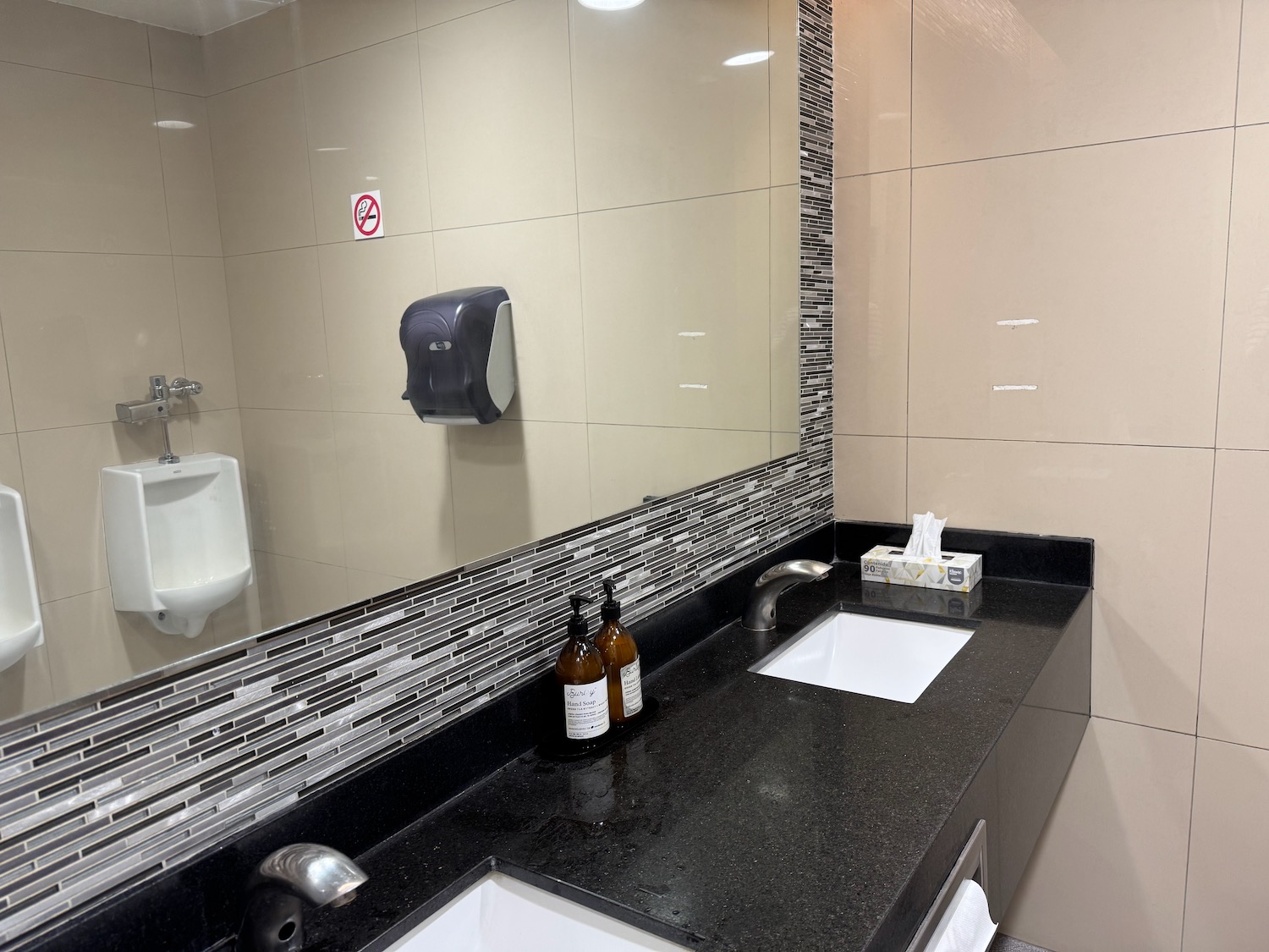 a bathroom with a mirror and a sink