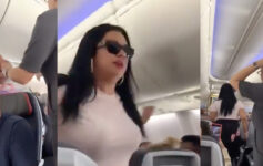 a woman in sunglasses on an airplane