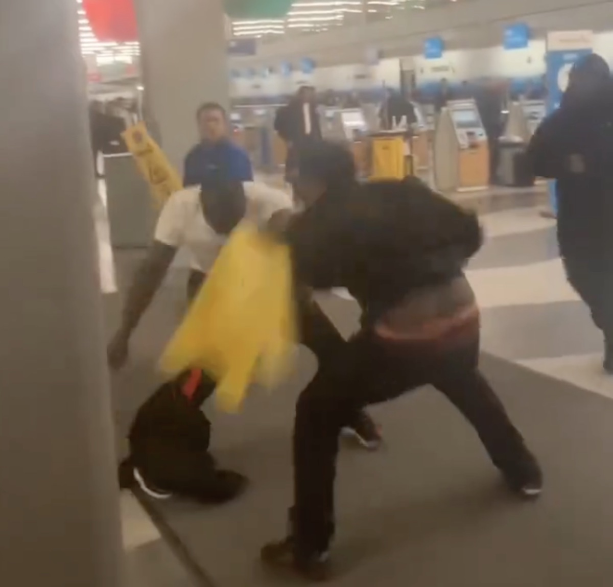 a group of people fighting in a building