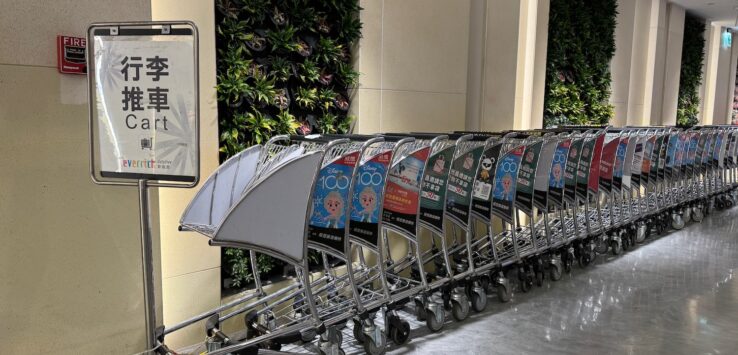 a row of luggage carts in a row