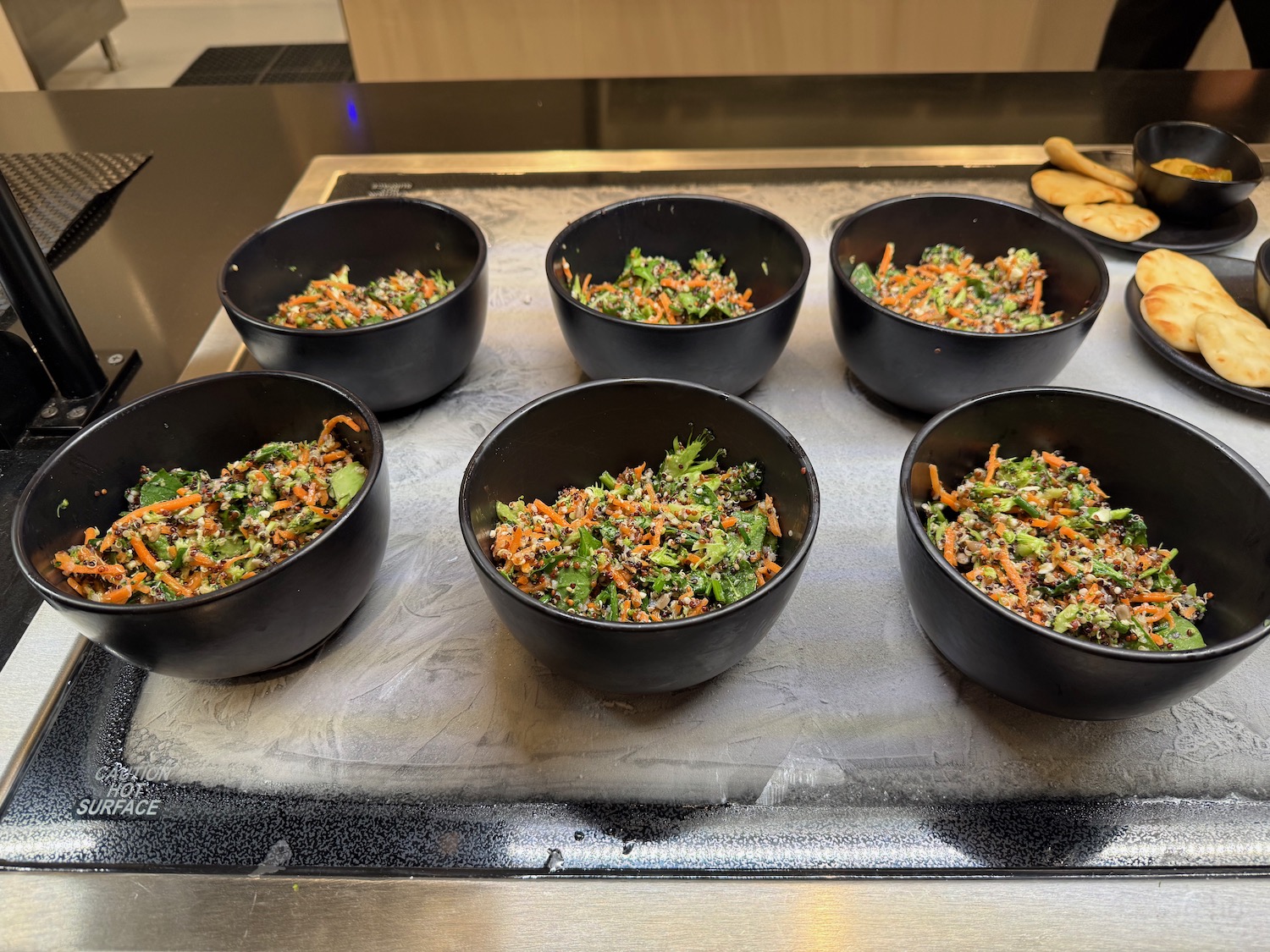 a group of bowls of food on a table