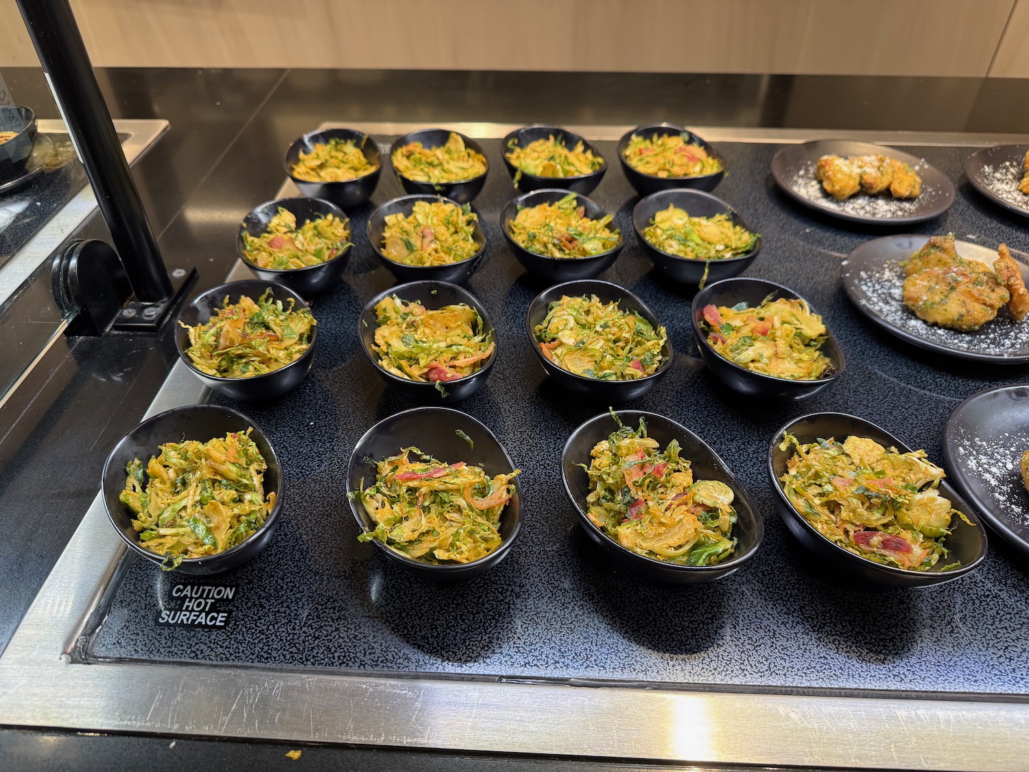 a group of bowls of food on a counter