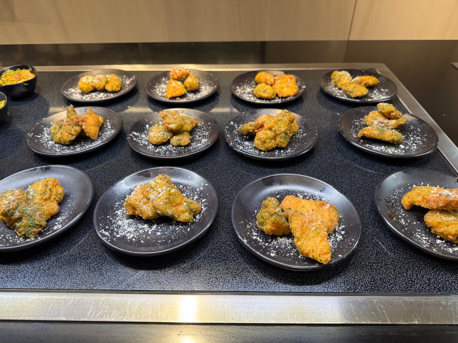 a group of plates of food on a table