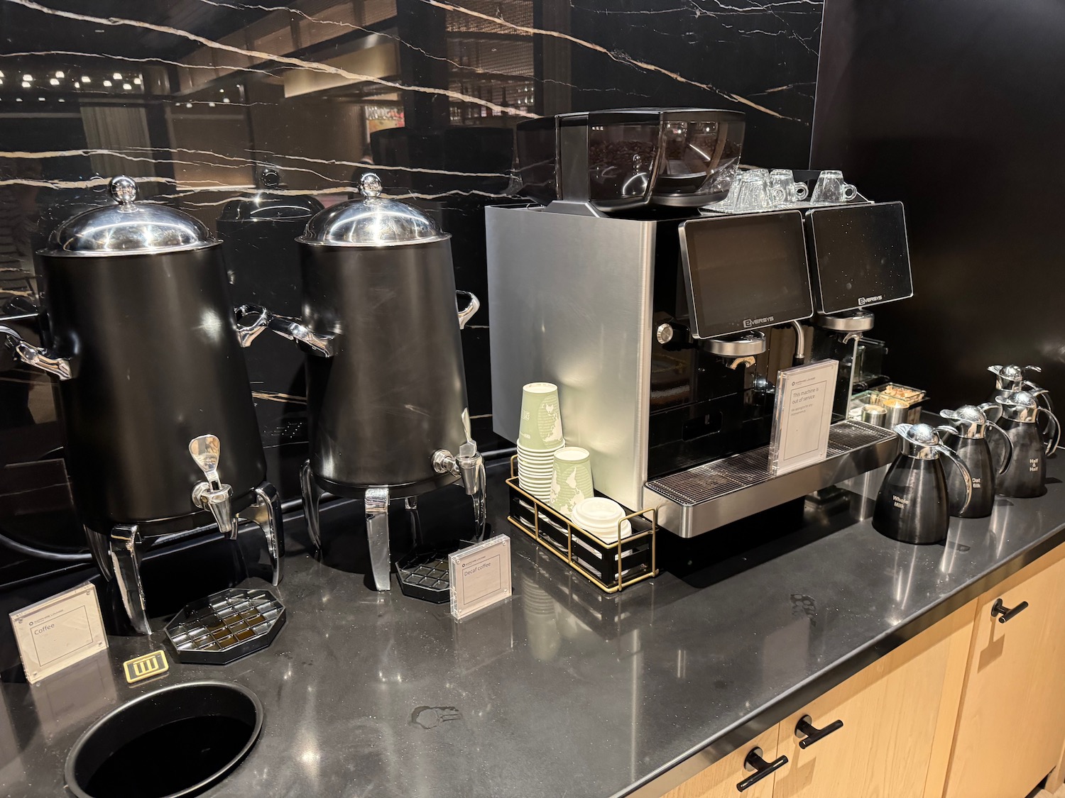 a coffee machine and coffee dispenser on a counter