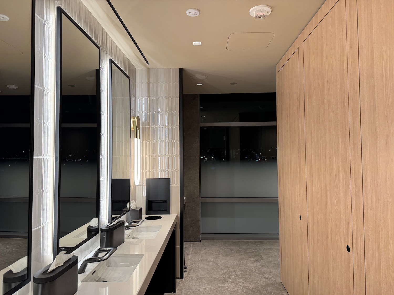 a bathroom with sinks and mirrors