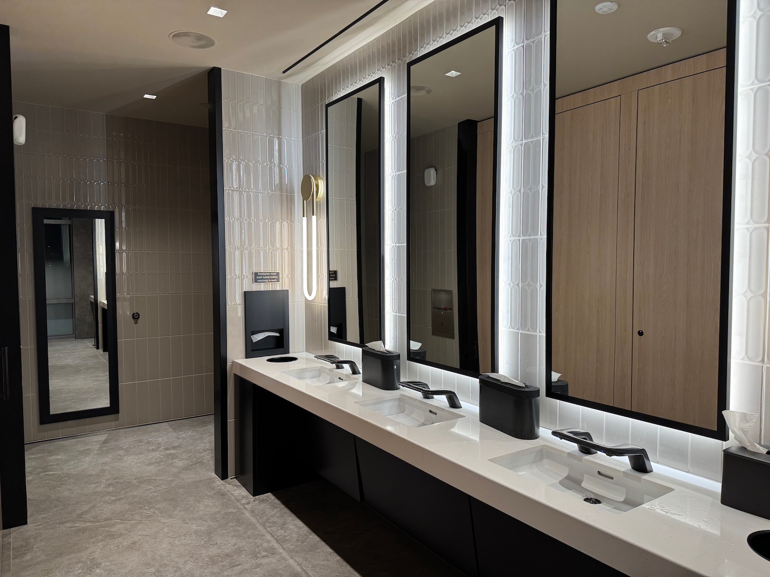 a bathroom with sinks and mirrors