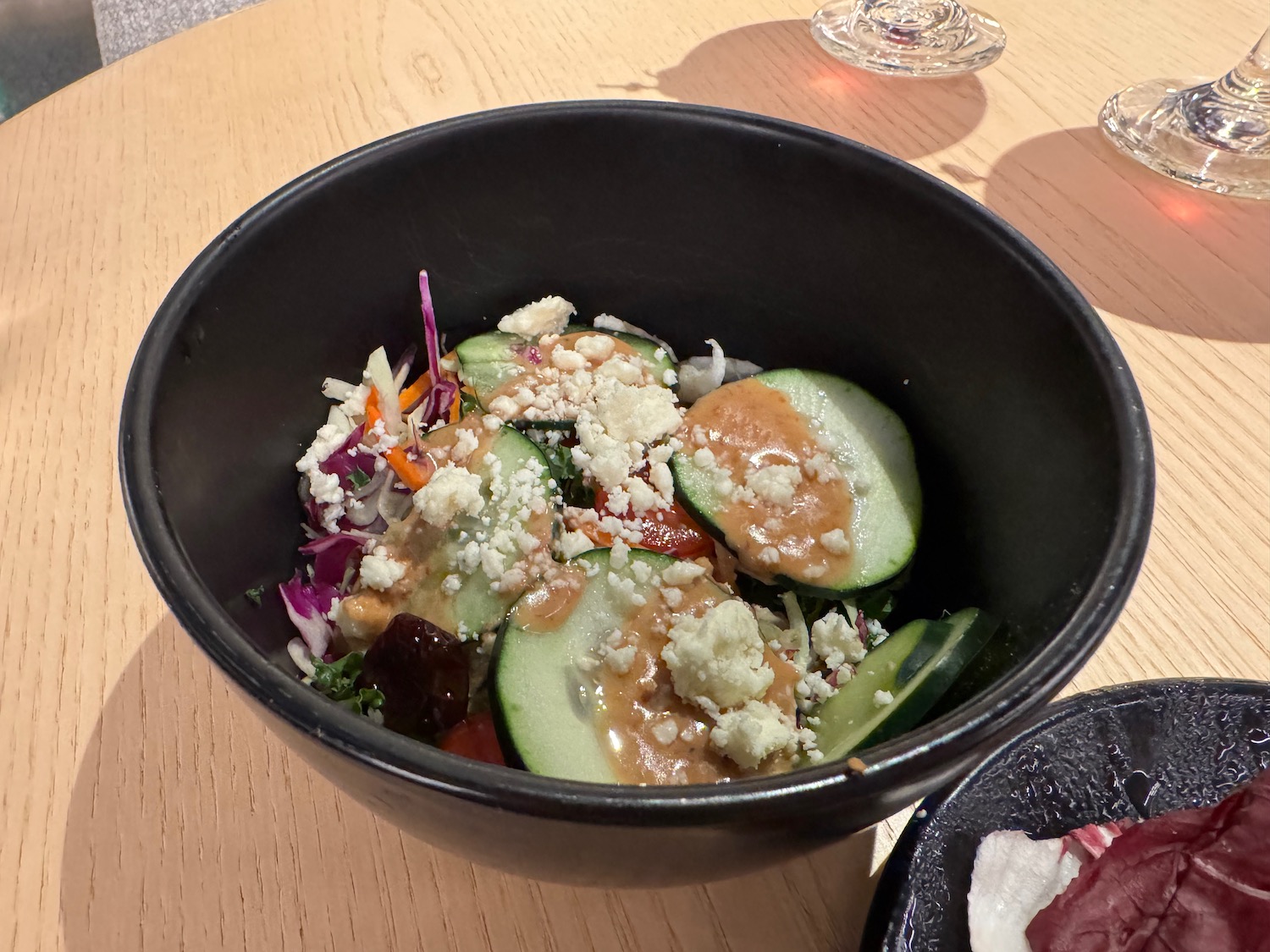 a bowl of salad on a table