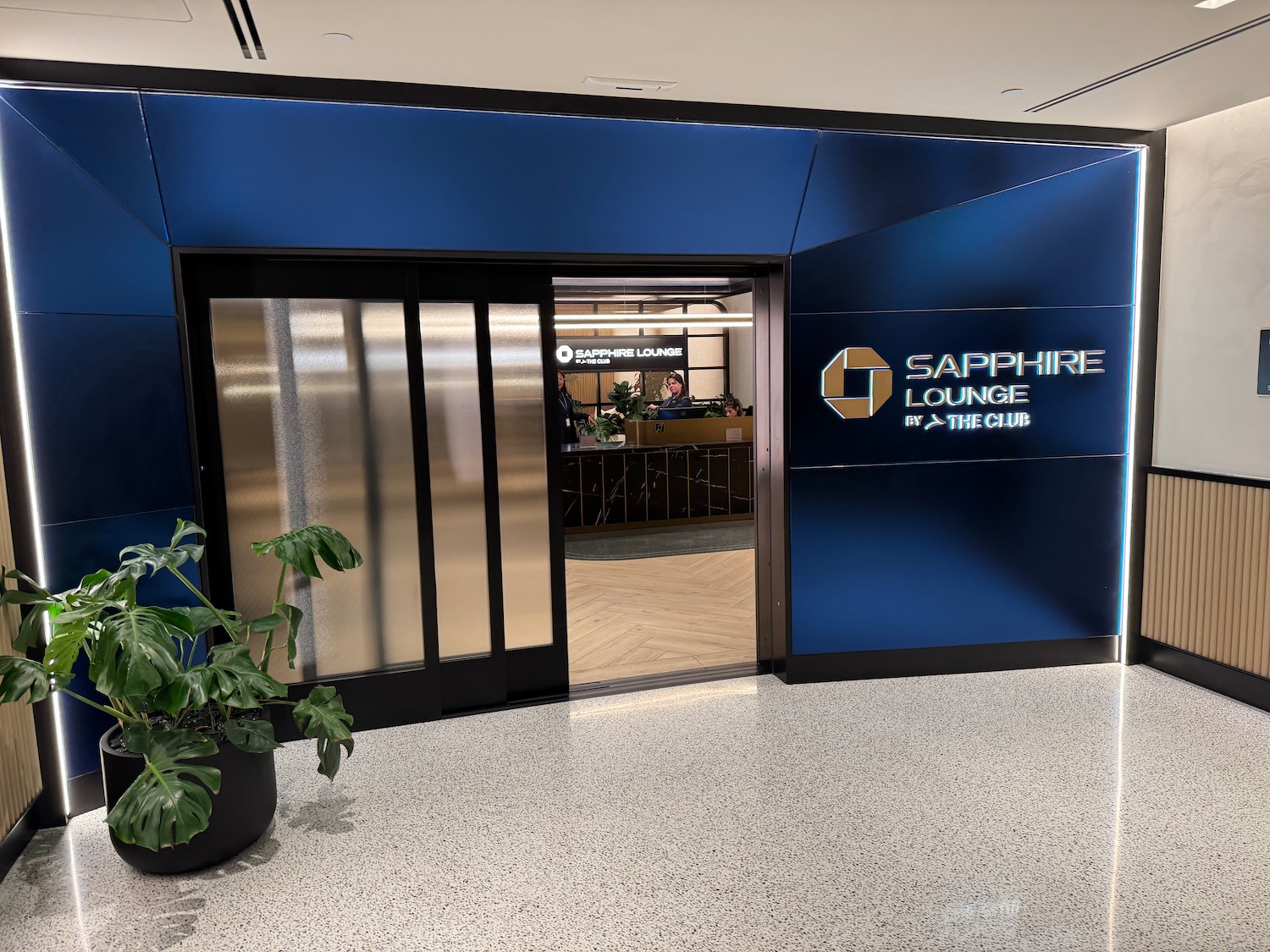 a blue wall with glass doors