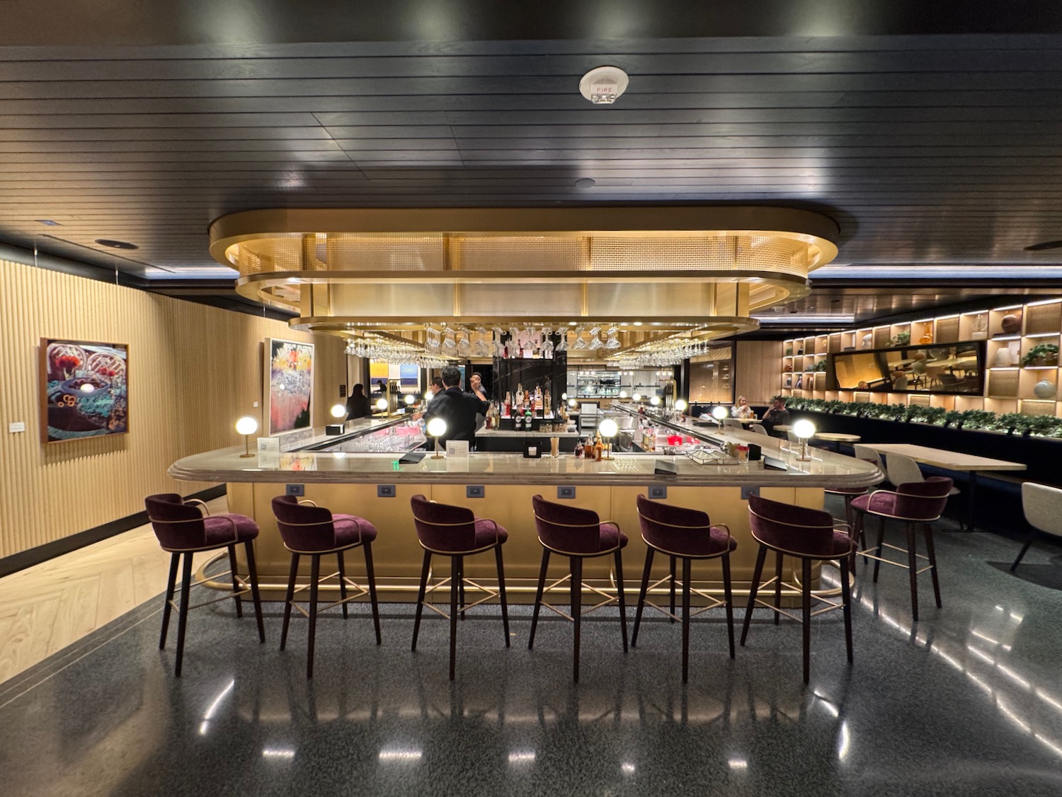 a bar with chairs and a counter