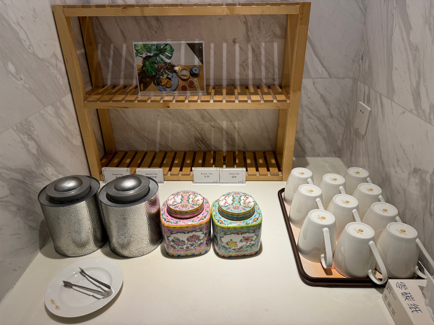 a shelf with utensils and containers on it