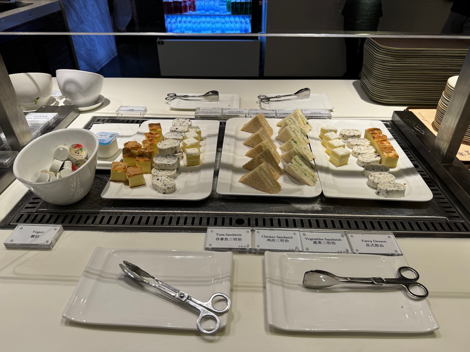 a table with plates of food and scissors