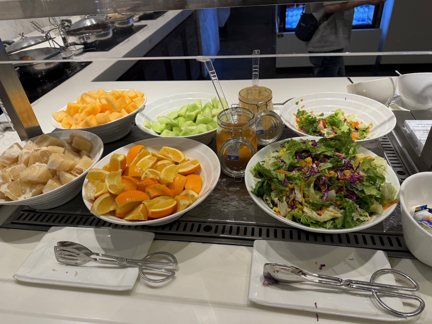 a group of bowls of food on a counter