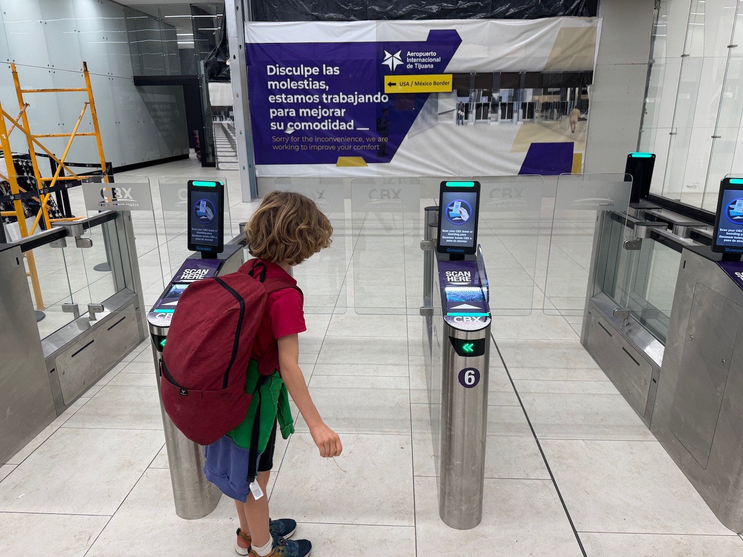 a person standing in front of a ticket machine