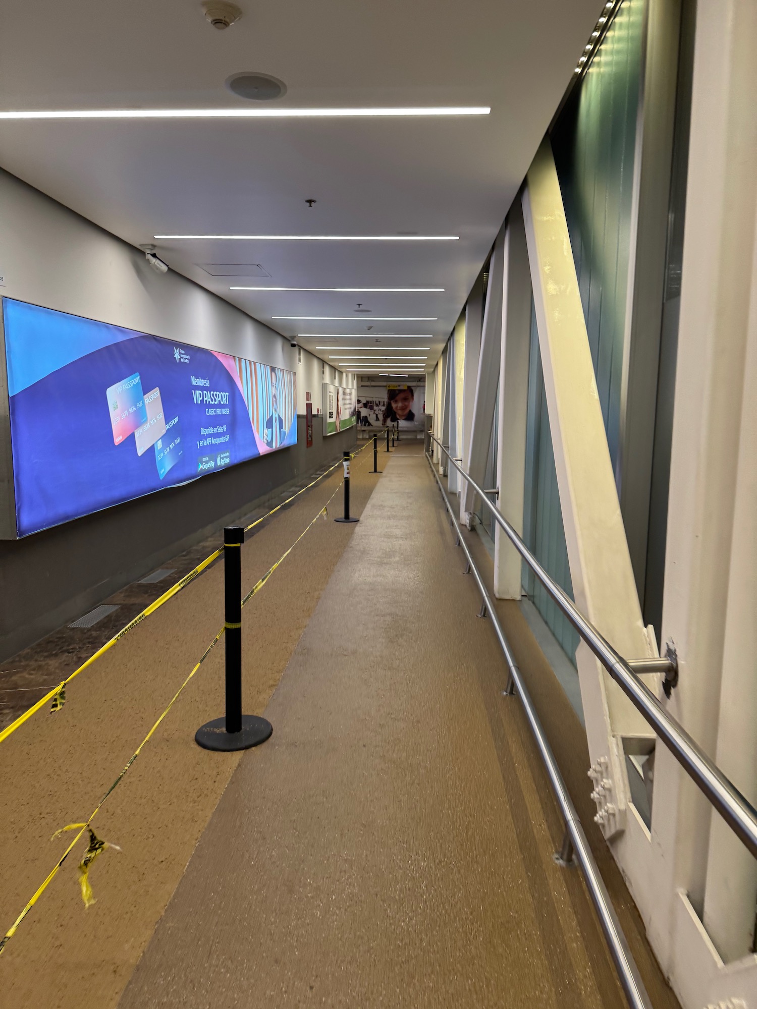 a long hallway with a sign on the wall