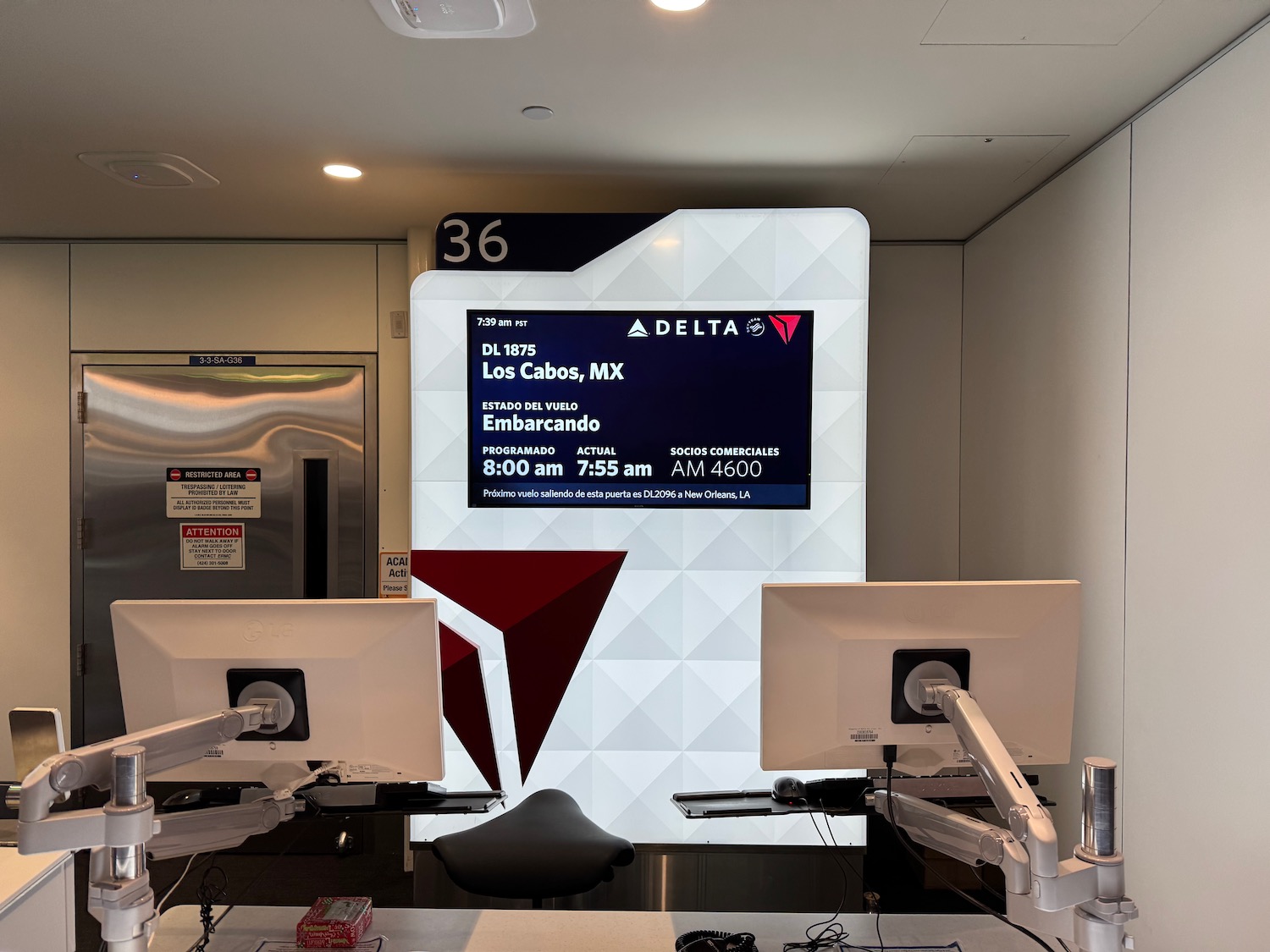 a computer desk with a screen on it