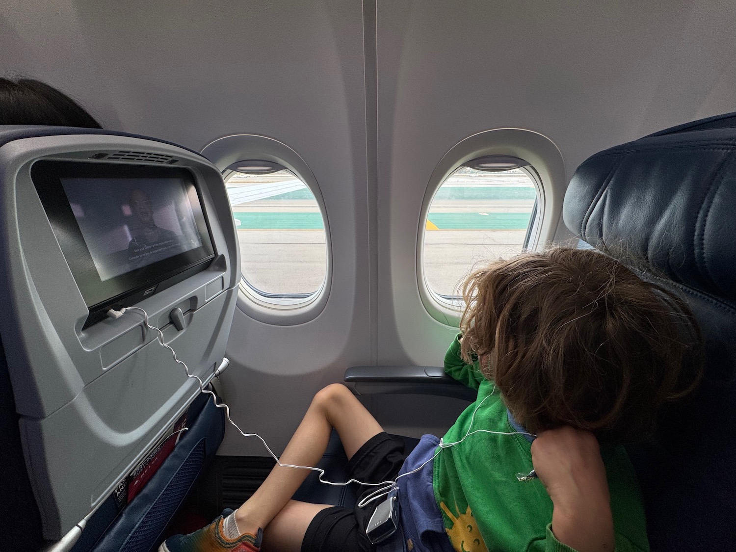 a child sleeping in an airplane