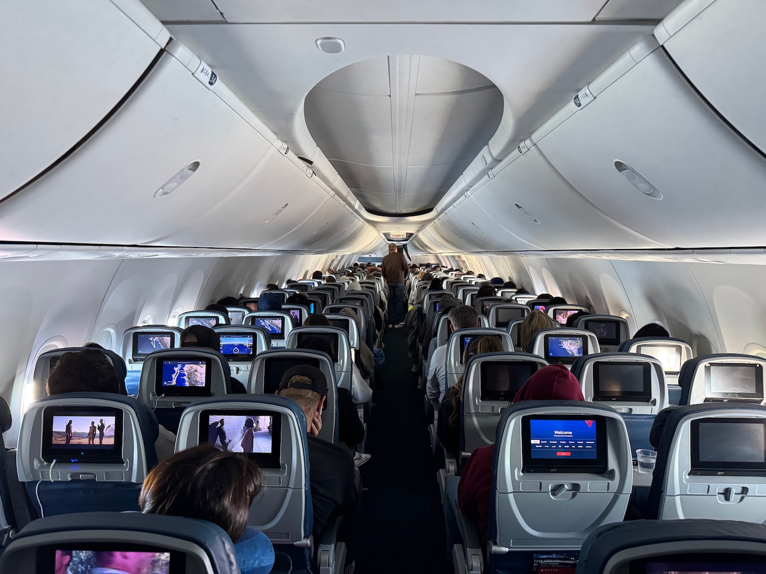 a group of people sitting in an airplane