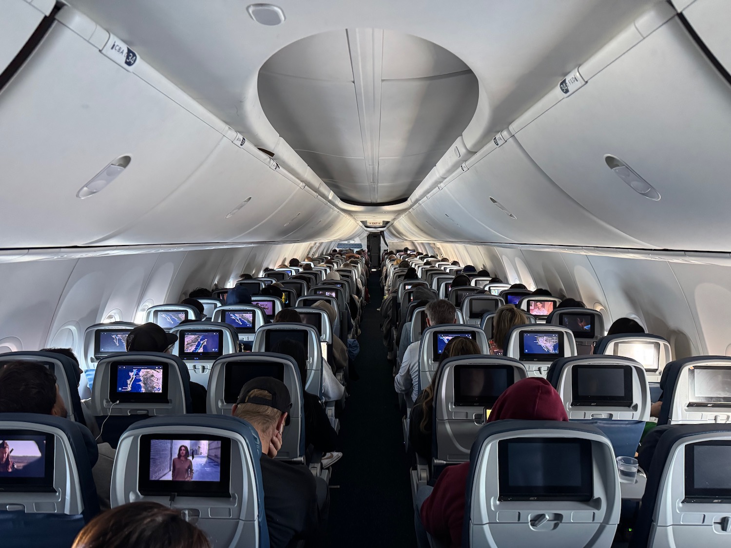 a group of people sitting in an airplane