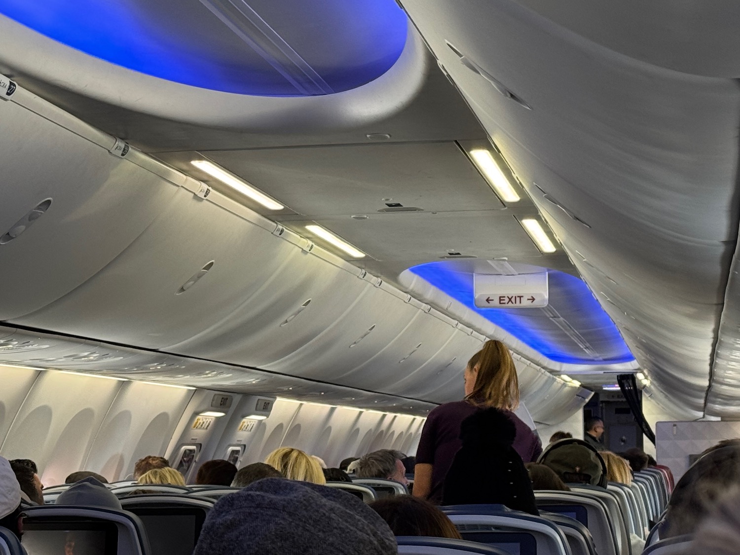 a group of people sitting in an airplane