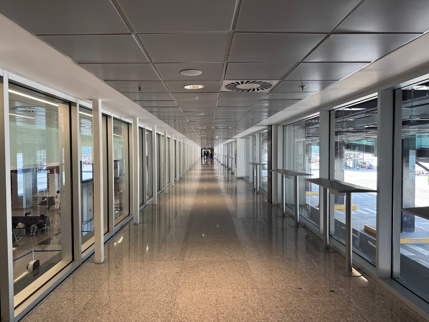 a long hallway with glass doors