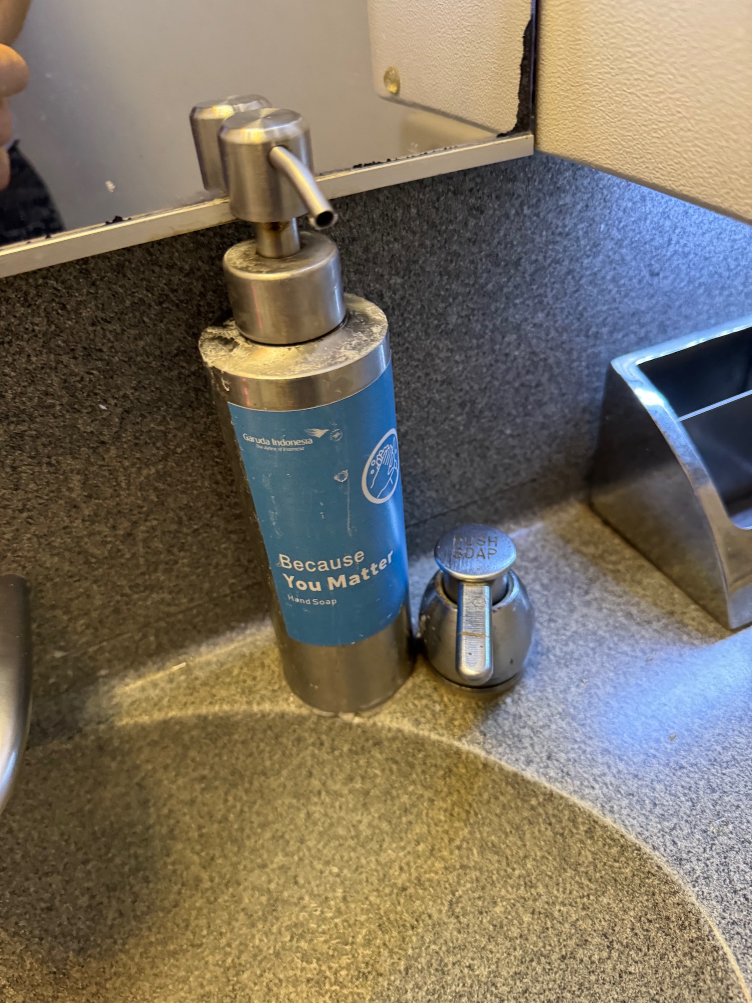 a soap dispenser on a counter