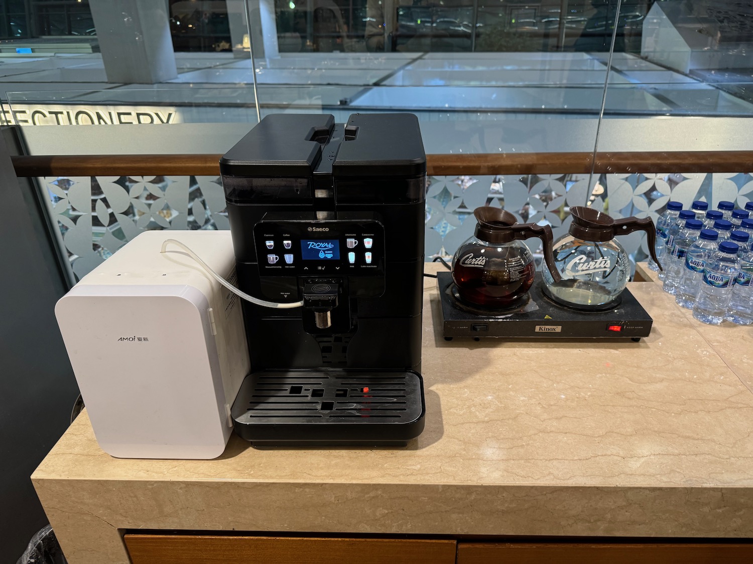 a coffee machine and a coffee pot on a counter