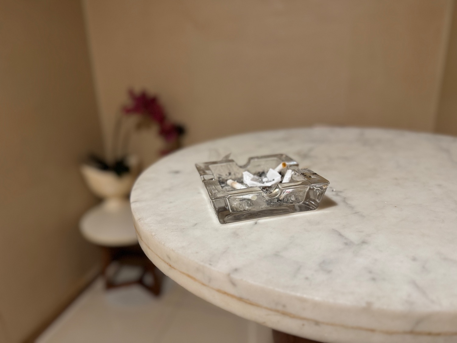 a glass ashtray on a table