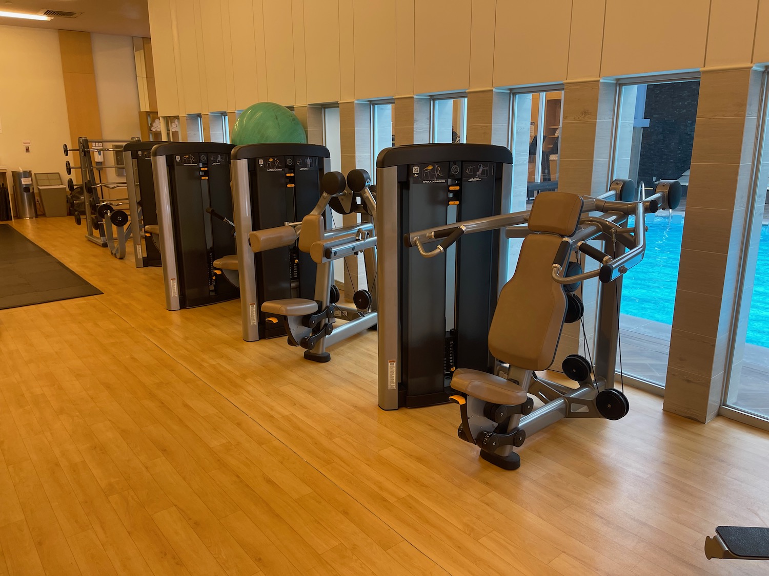 a row of exercise equipment in a gym