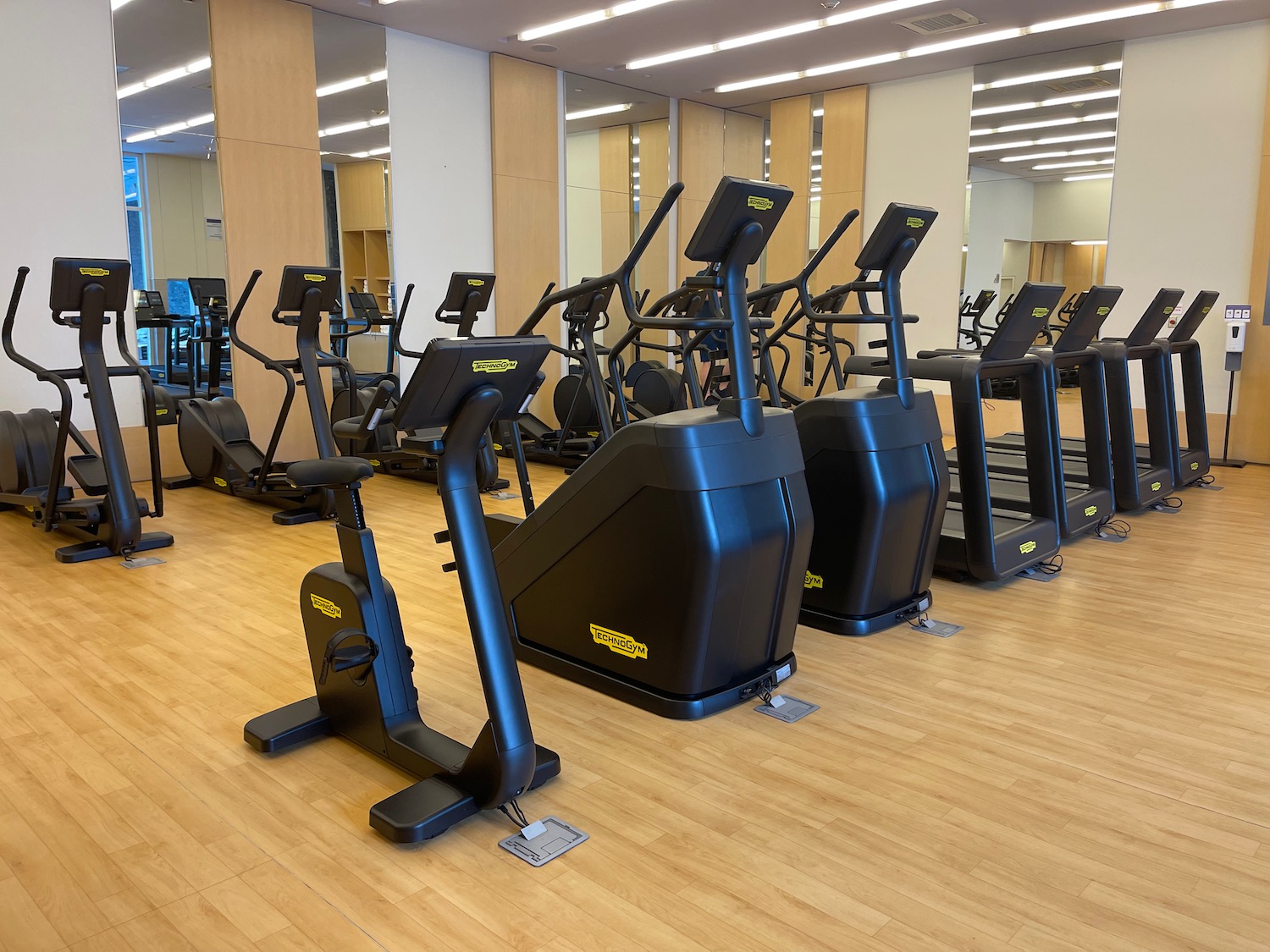 a group of exercise machines in a gym