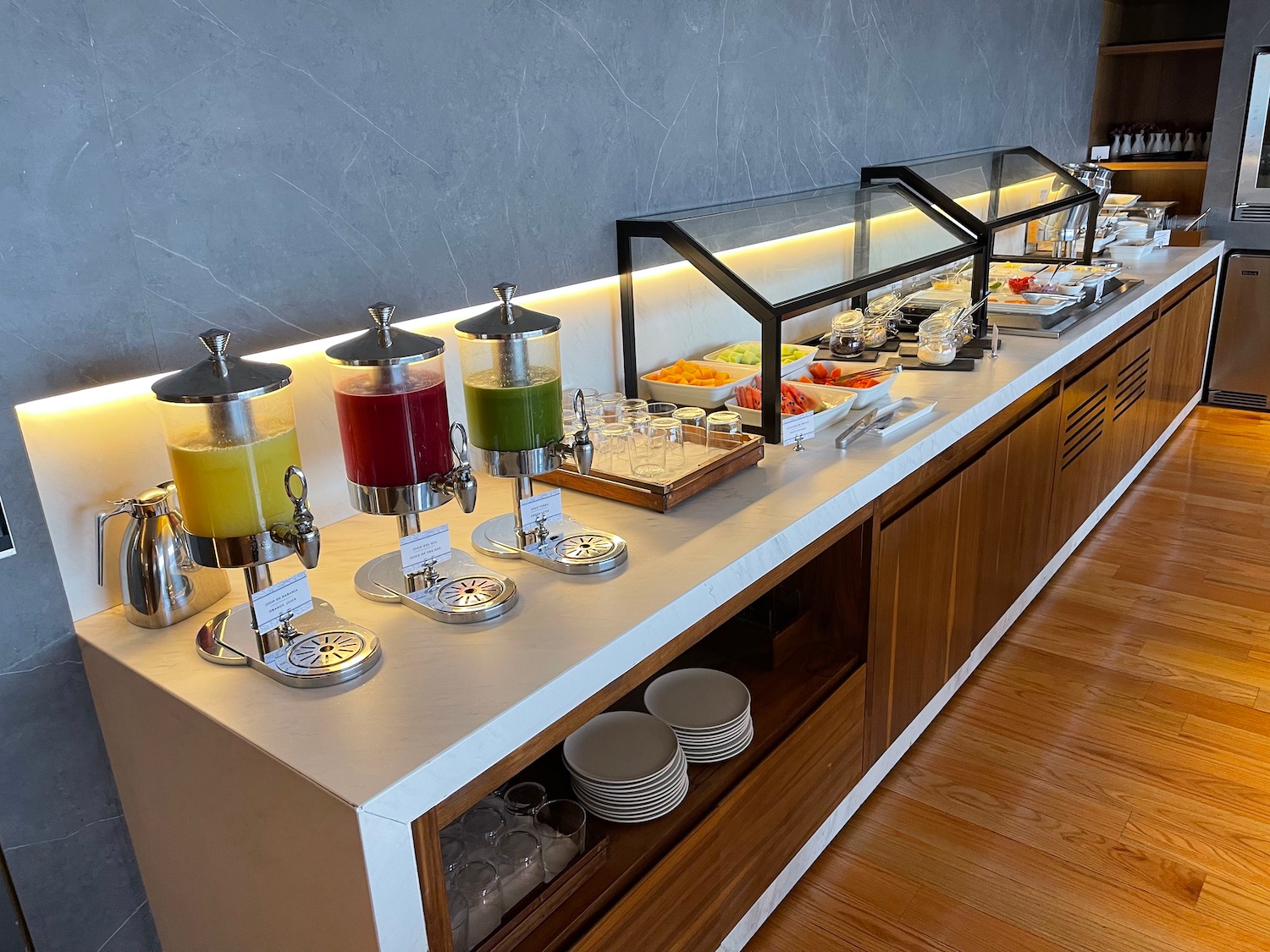 a buffet with drinks and food on it