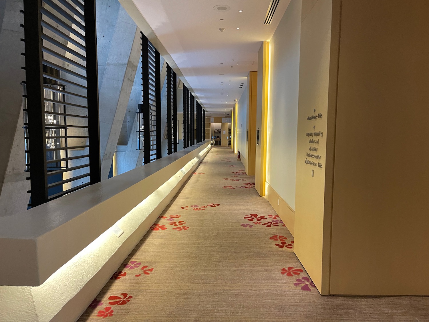 a hallway with a flower carpet