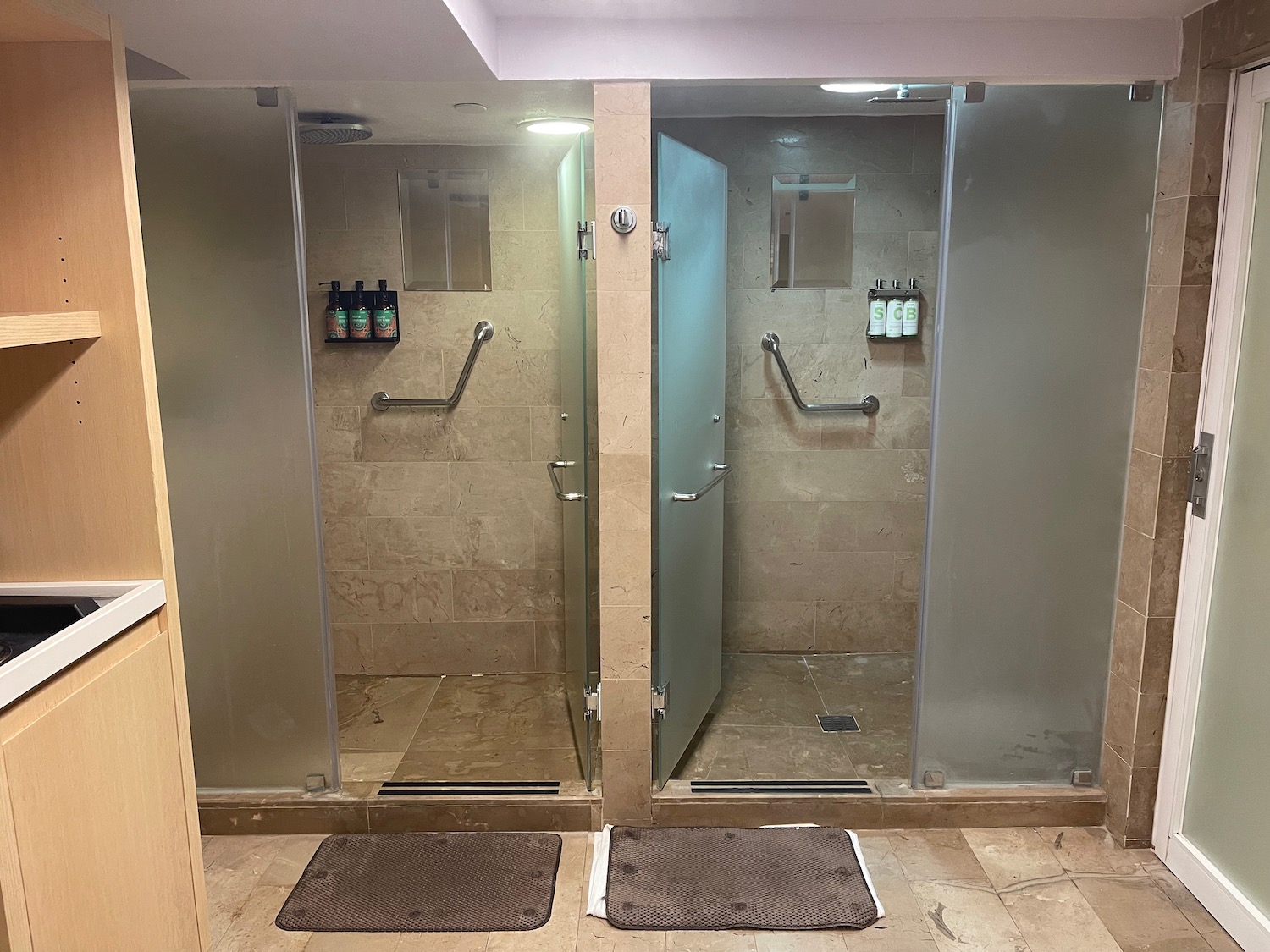 a two shower doors in a bathroom