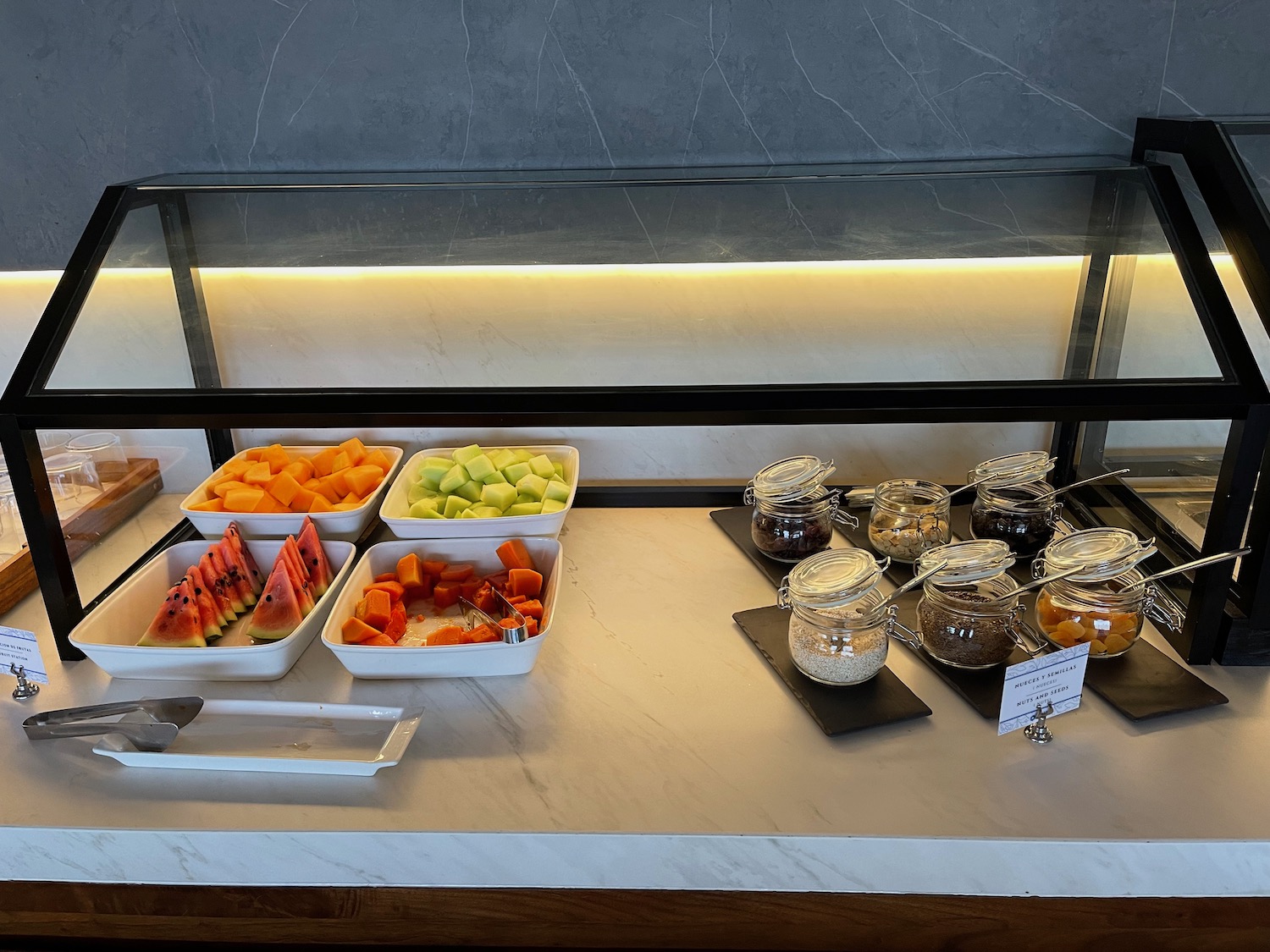 a buffet table with different types of fruit