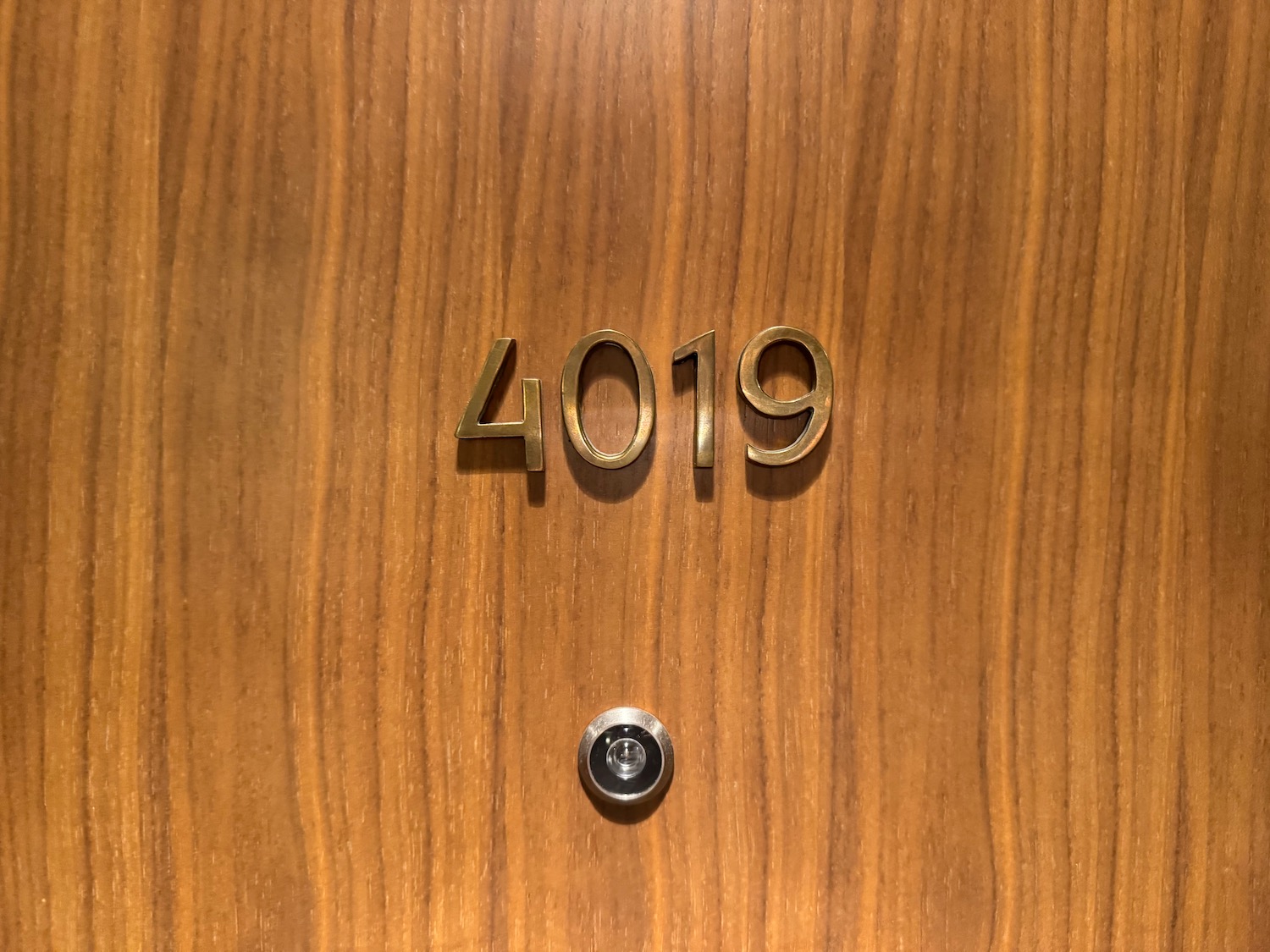 a door with numbers and a hole in the middle