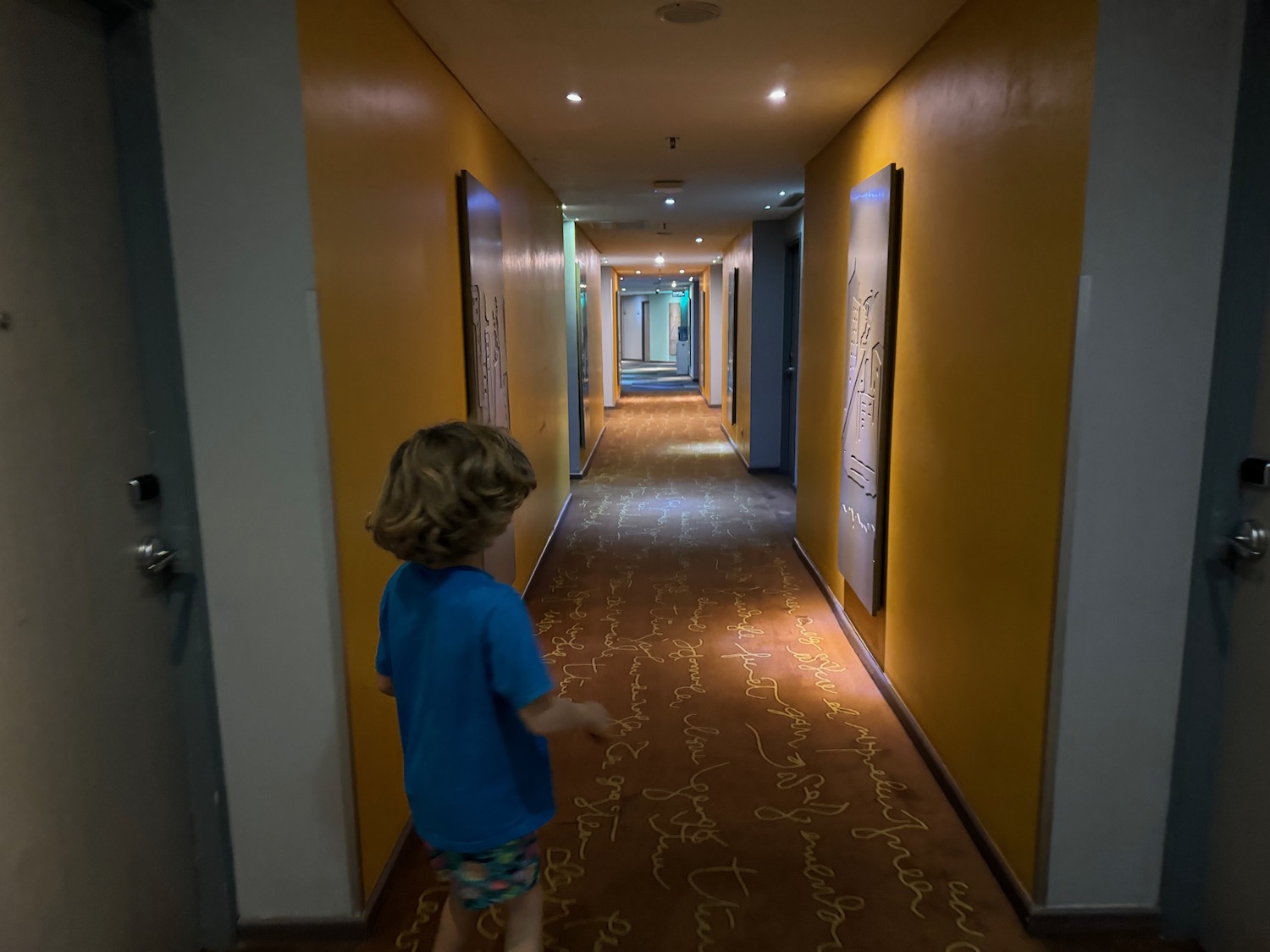 a child walking in a hallway