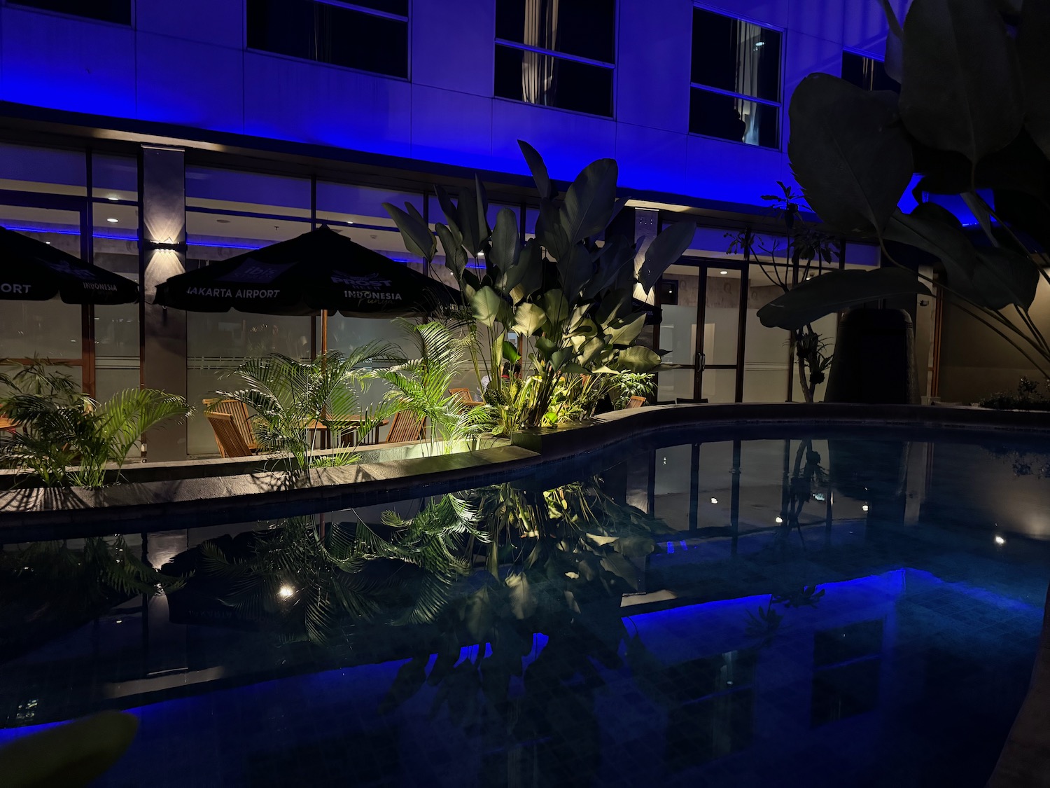 a pool with a building in the background