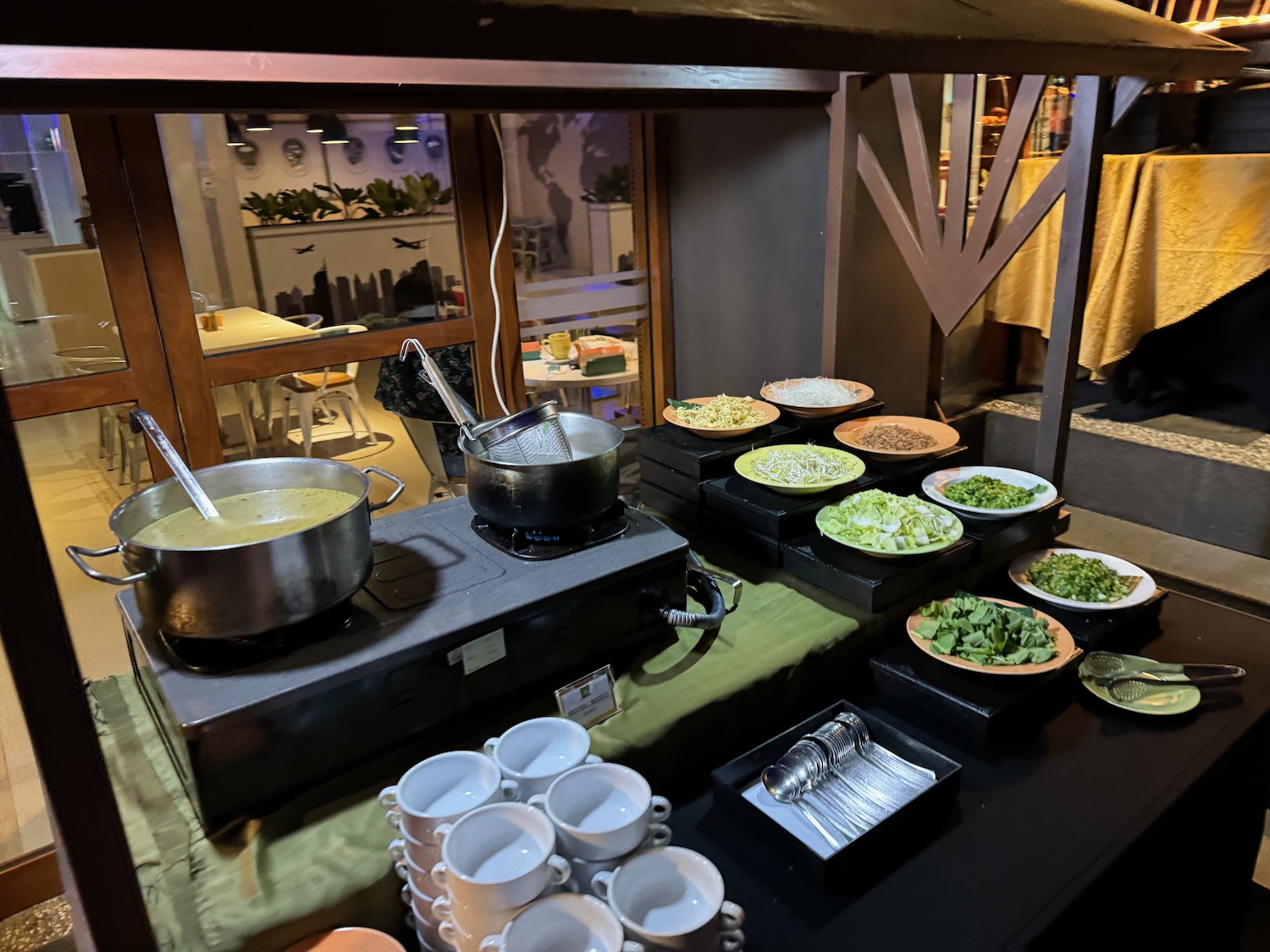 a table with plates of food and utensils