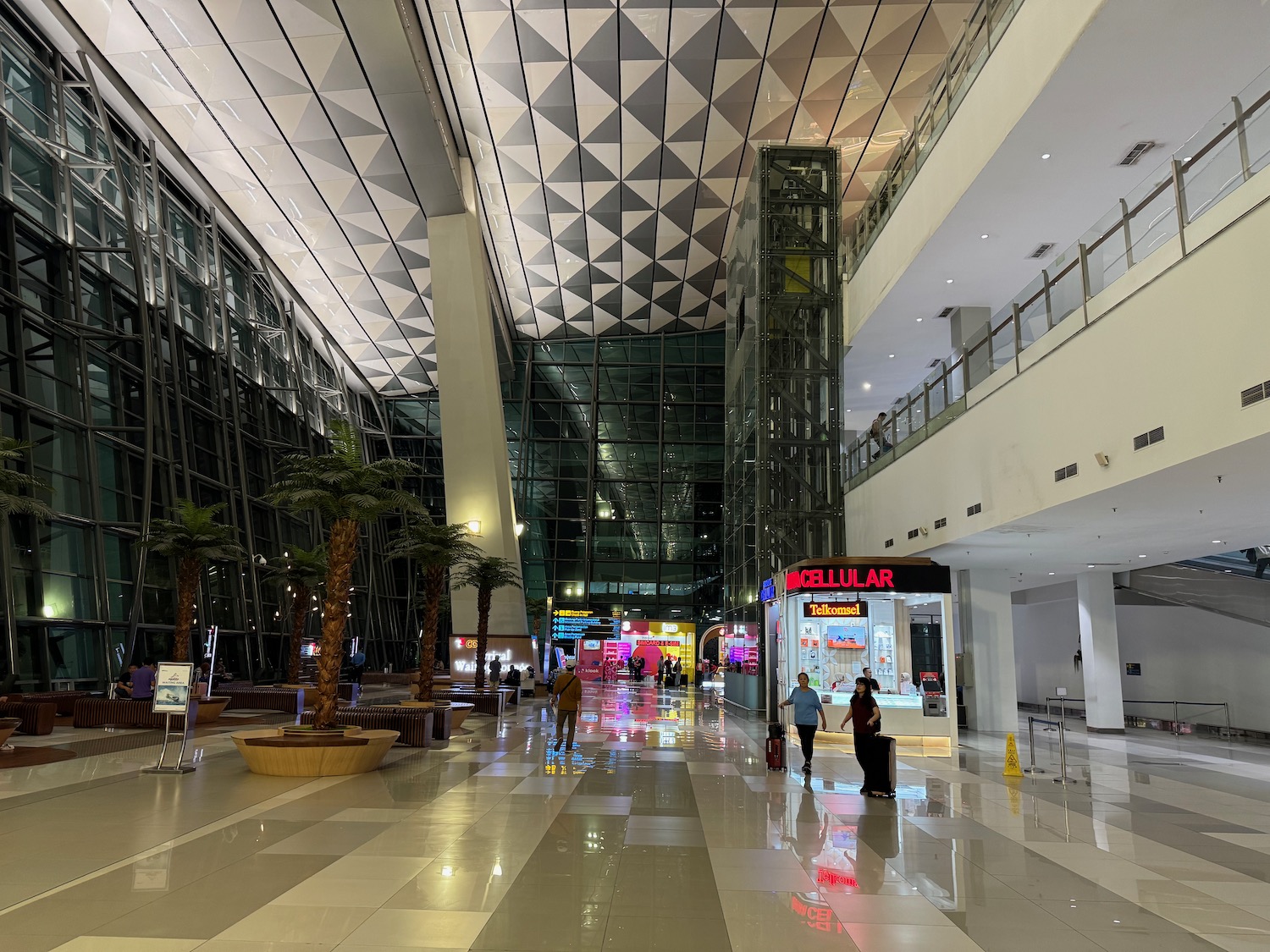 people walking in a large building