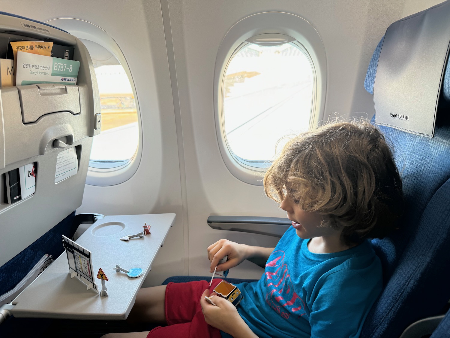 a child sitting in an airplane