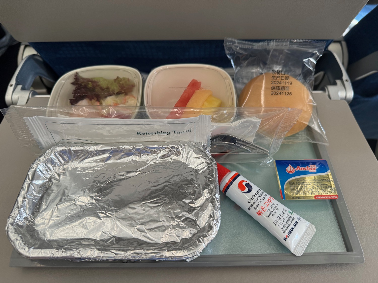 food in a tray on a plane