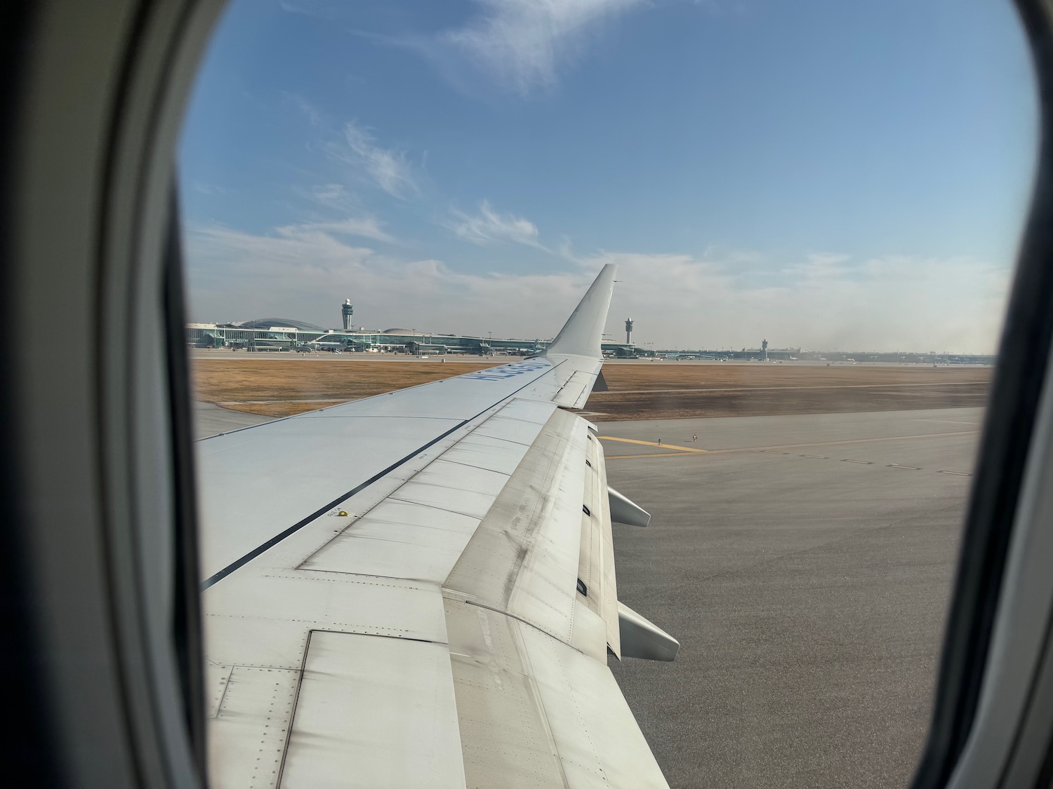 an airplane wing on a runway