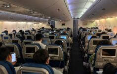 a group of people sitting in an airplane