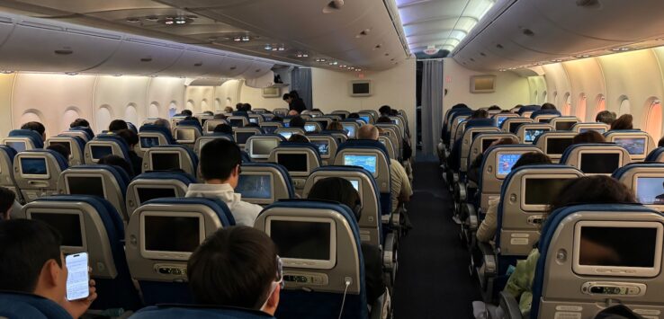 a group of people sitting in an airplane