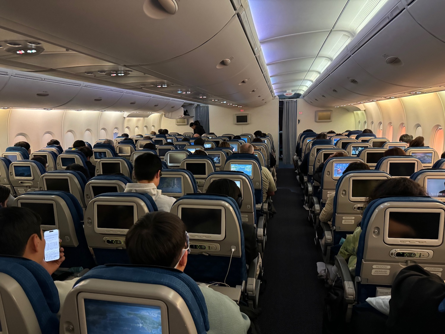 a group of people sitting in an airplane