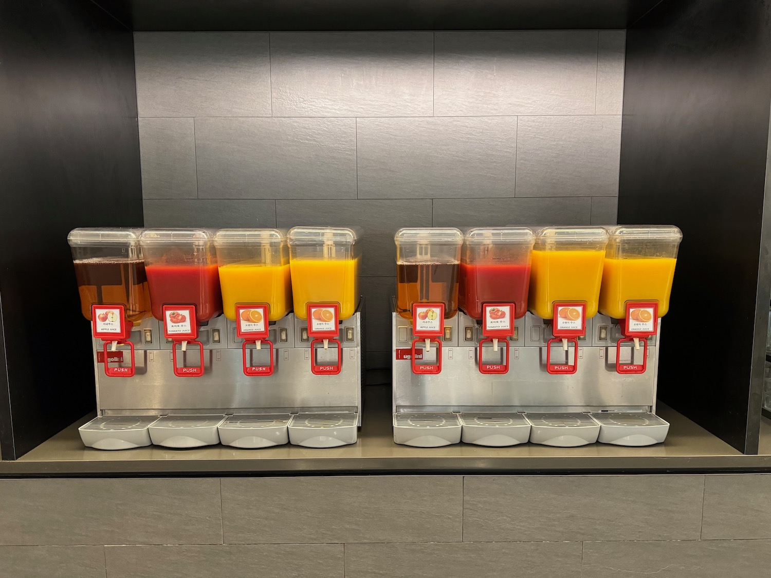 a group of juice dispensers