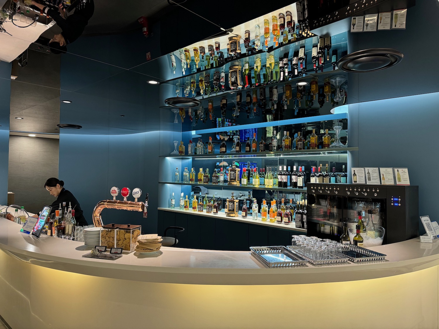 a bar with bottles on shelves