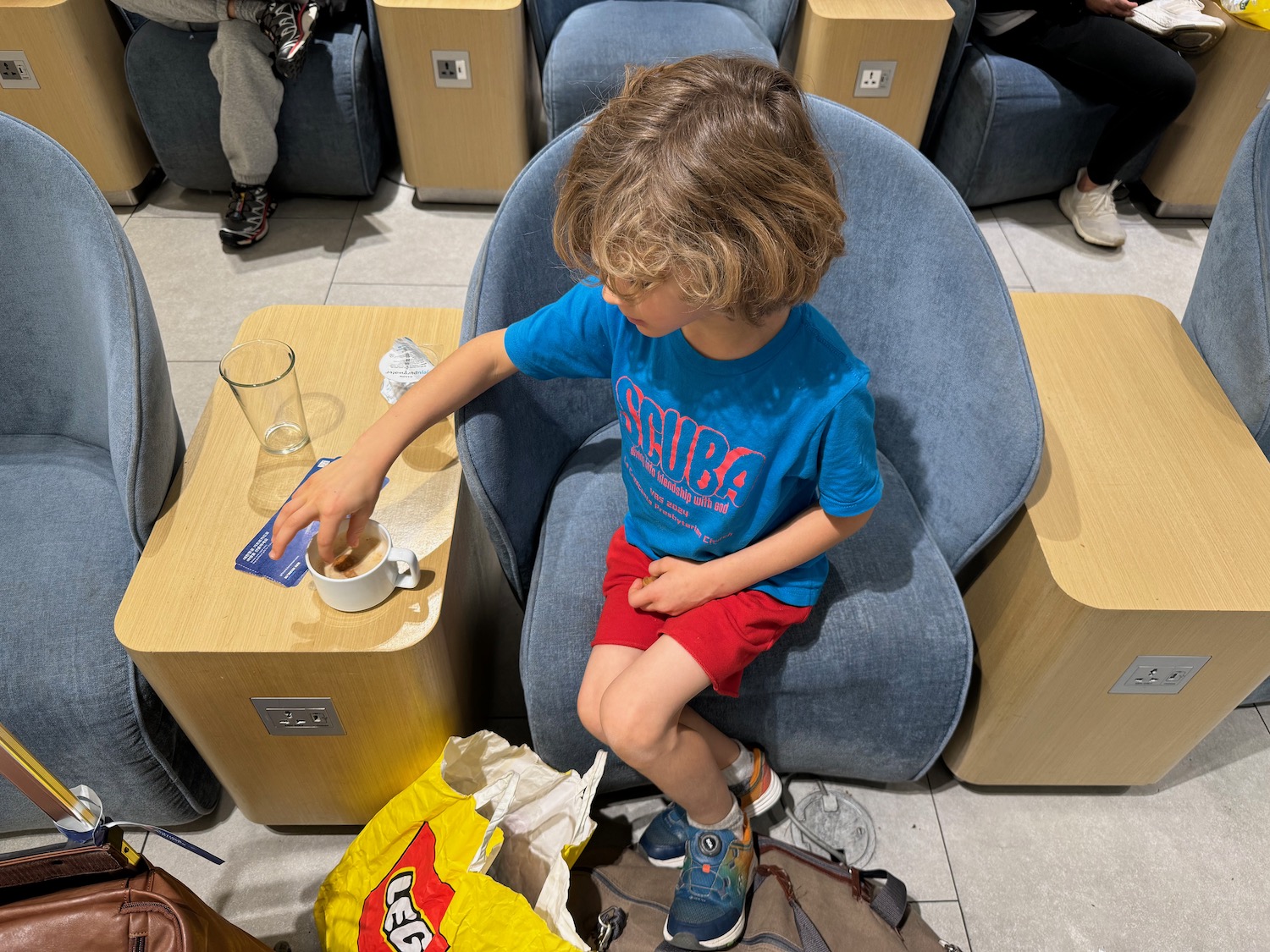 a boy sitting in a chair